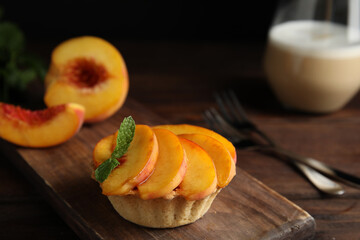 Delicious peach dessert on wooden table, closeup - obrazy, fototapety, plakaty