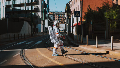 spaceman in a futuristic station. Man with space suit walking in an urban area