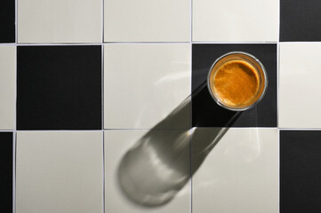 White And Black Square Tiled Paper and Espresso Cup