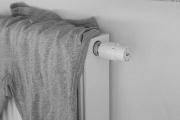 drying clouthes on a radiator, Winter time, cold weather lifestyle, Winter heating efficiency
