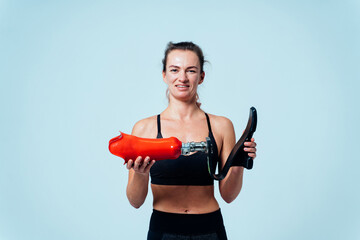 Amputated woman. Cinematic image of a beautiful young woman with leg prosthesis.