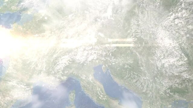 Earth zoom in from outer space to city. Zooming on Lienz, Austria. The animation continues by zoom out through clouds and atmosphere into space. Images from NASA