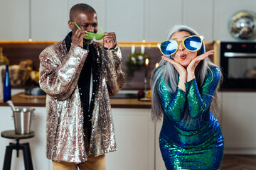 cinematic image of an happy multiethnic senior couple. Indoors Lifestyle moments at home. Concept...