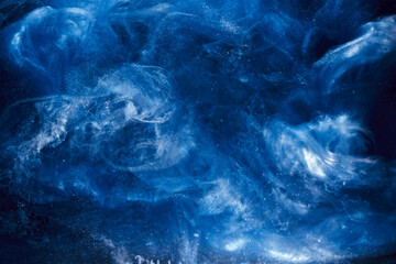 Liquid fluid art abstract background. Blue acrylic paint underwater, galactic smoke ocean