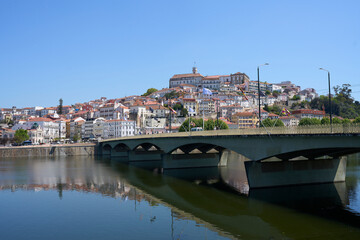 Fototapeta na wymiar Santa Clara bridge over Mondego river in Coimbra city in Portugal