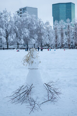 Intense snowfall in Zurich, Switzerland: A snow princess in the park Josefwiese