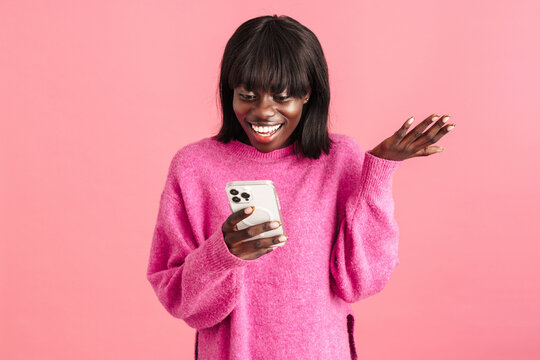 Young Beautiful Smiling African Woman Looking Oh Her Phone