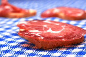 woman eating some toast with iberian cured ham