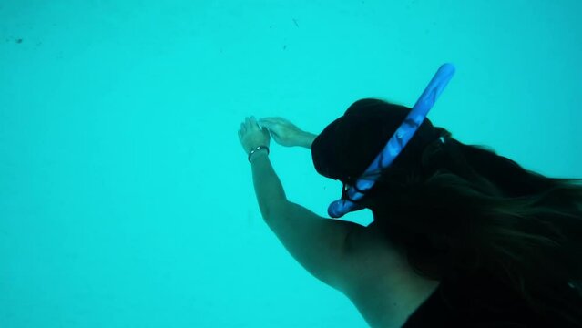 Female Tourist Swimming Towards Great Barrier Reef Undersea - Bimini, The Bahamas