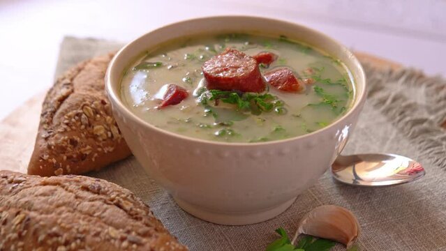 Rotating video with green Portuguese style soup 