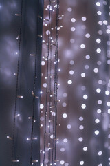 Christmas garland. Home decoration for the new year. Background with holiday lights
