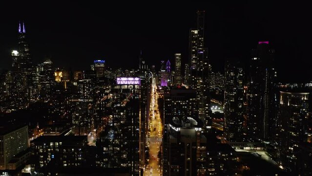 High Aerial Flight Above Chicago Skyscrapers at Night