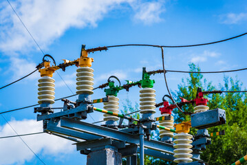 Electric power transmission lines.High voltage switchgear and equipment of power plant.Blue sky...