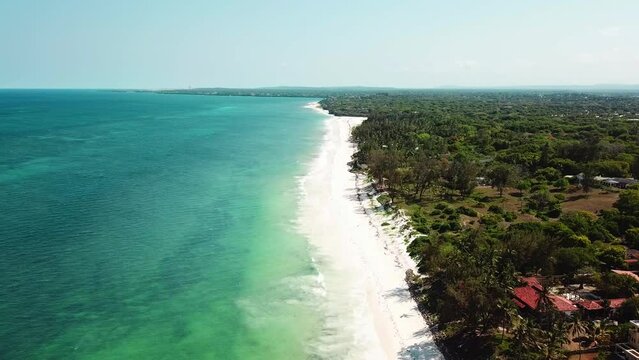 Dense Forest And White Sand Seashore At Kilifi Bay Beach Resort In Coast Of Kenya, East Africa. Aerial Wide Shot
