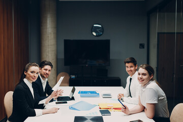 Businessman and businesswoman team at office meeting. Business people group conference discussion sit at table with boss man and woman