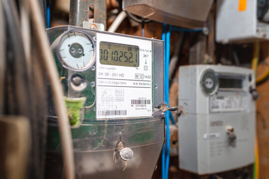 Two smart electric power meter counter measuring power usage.Close-up of modern smart grid residential digital power supply meter.Indoors shot.Selective focus.