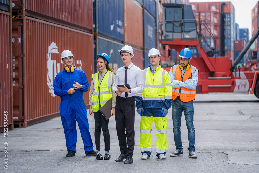Poster Manager and Supervisor dock cargo checking and control loading Containers box at Container yard warehouse,Unity and teamwork concept.