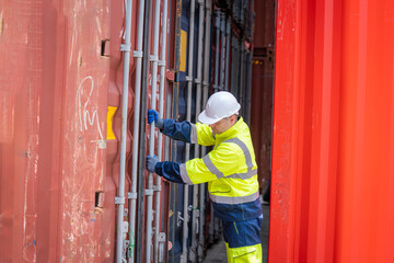 Workers working at containers inside the warehouse,Logistic and business export,Industrial Container yard for Logistics oversea import export shipping business.