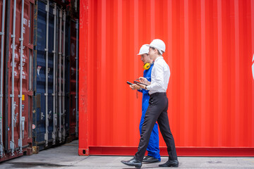 Businessman and Technicians or engineer work at Container cargo site check up goods in container.