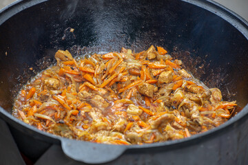 Photo of the stewed meat in cast iron