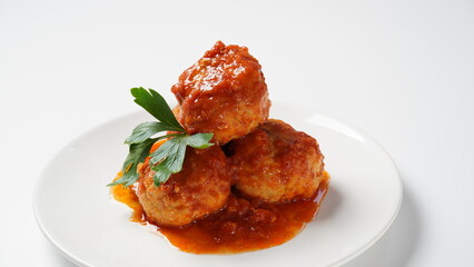 Meatballs in sweet and sour tomato sauce with spices