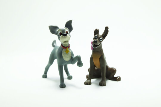 Dog toy from the movie Lady and the Tramp. Dante. Xoloitzcuintle dog from movie Coco. Characters from the Disney and Pixar films. Isolated white. Domestic animals. McDonald's happy meal toys.