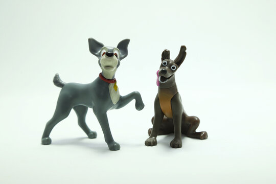 Dog toy from the movie Lady and the Tramp. Dante. Xoloitzcuintle dog from movie Coco. Characters from the Disney and Pixar films. Isolated white. Domestic animals. McDonald's happy meal toys.