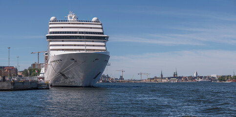 The cruise ship MCS Poesia at the pier Masthamnen and the old town Gamla Stan in background, a...