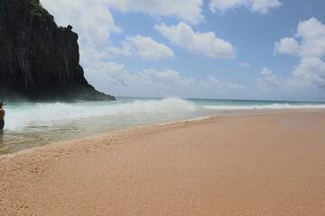Two Brothers mountain partial view from the sand at Cacimba do Padre beach, Fernando de Noronha, Brasil.