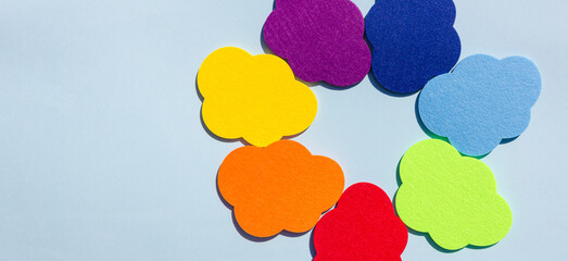 Banner. Rainbow color clouds and lettering Back To School on the blue background. Back to school concept. Flat lay.