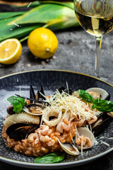 Italian risotto with shrimps, mussels, octopus, clams. Mediterranean cuisine. Restaurant menu, dieting, cookbook recipe top view