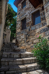 Fototapeta premium Beautiful narrow streets of the old town. Center of Marmaris. White buildings. European architecture. Lovely narrow streets. Ancient houses.