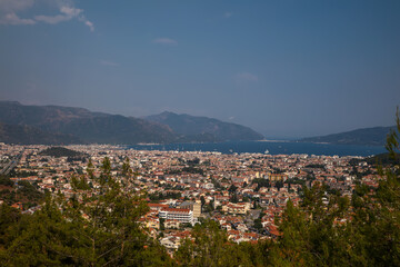A beautiful city by the sea. Little houses. Evening in Turkey. Sunny evening. Beautiful nature. Small resort town by the sea.