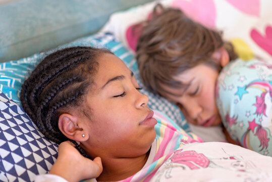 two girls sleeping together, multi racial friendship, black and white girls friendship, black lives matter concept
