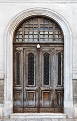 Vintage brown wooden old door in the centre of Athens in Greece.