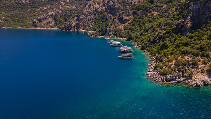 Obraz premium Beautiful view of the Aegean coast. Beautiful colorful sea. Beautiful water. Road along the sea. Beautiful nature. Sunny day.