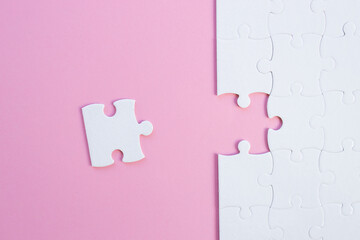 Empty white jigsaw puzzle with missing pieces