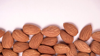 Almonds top view isolated on white background.