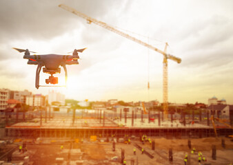 Drone over construction site. video surveillance or industrial inspection.