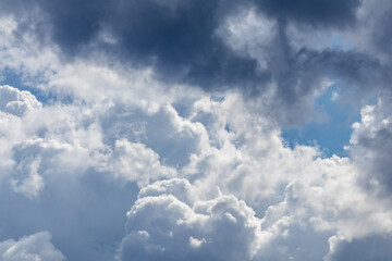 Sunny high layered white epic clouds on blue sky. Heavenly cloudscape background