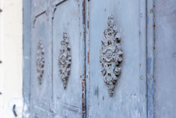 Ancient decoration on a old Steel and rusty door