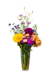 Beautiful bouquet of vibrant colored fresh flowers in a crystal vase isolated with a shallow depth...