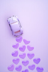 Creative holiday valentines day concept photo of car with hearts.