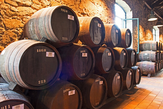 Wooden barrels are used to mature port wine. 