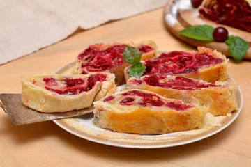 Foto op Plexiglas appetizing homemade cherry strudel close-up © Viktoriia Kolosova