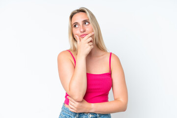 Young caucasian woman isolated on white background having doubts and with confuse face expression