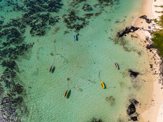 Aerial drone view of boats close a beach at Belle Mare Mauritius