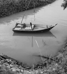 traditional rowing fishing boat on the river