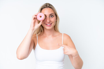 Obraz na płótnie Canvas Young caucasian woman isolated on white background holding a donut and happy