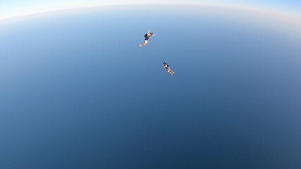 Fototapeta na wymiar Skydiving in the Rio de Janeiro. A summer day, shirtless on the beach.